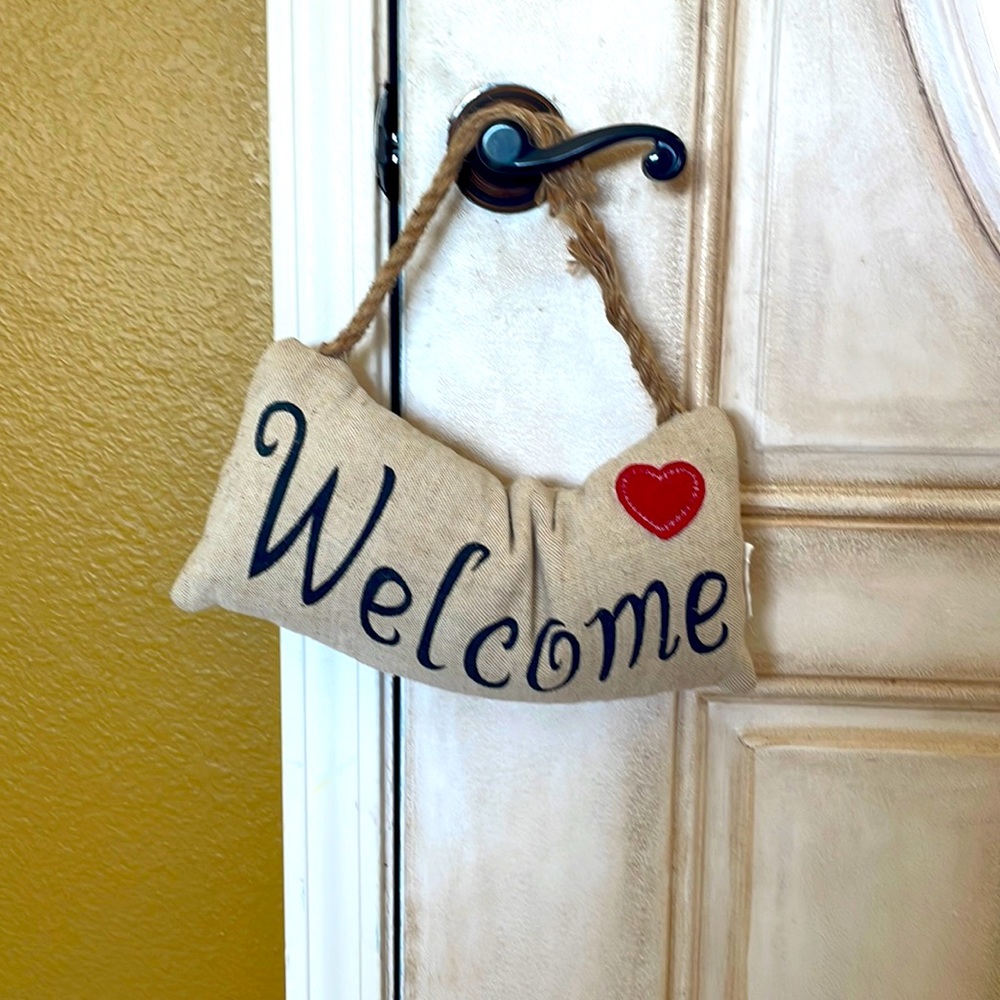 Hobby Lobby decorative door stopper. “Welcome” with cute ❤️